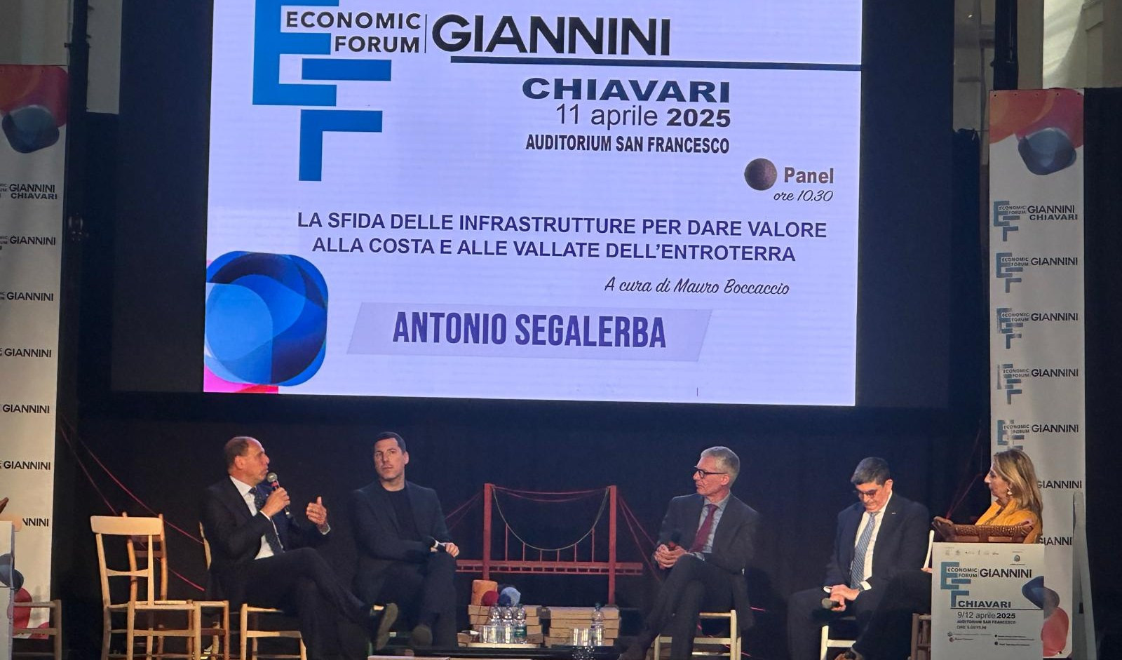 La tavola rotonda del Forum Giannini dedicata alle infrastrutture Cinque persone sedute in un palco